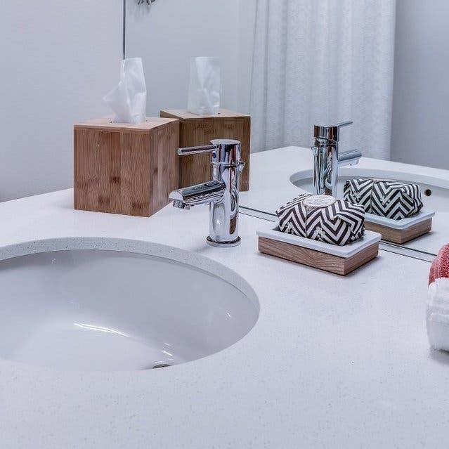 Osprey Apartments - bathroom sink with white countertops
