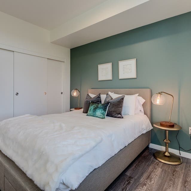 Osprey Apartments - spacious bedroom with hardwood-style flooring and large closet